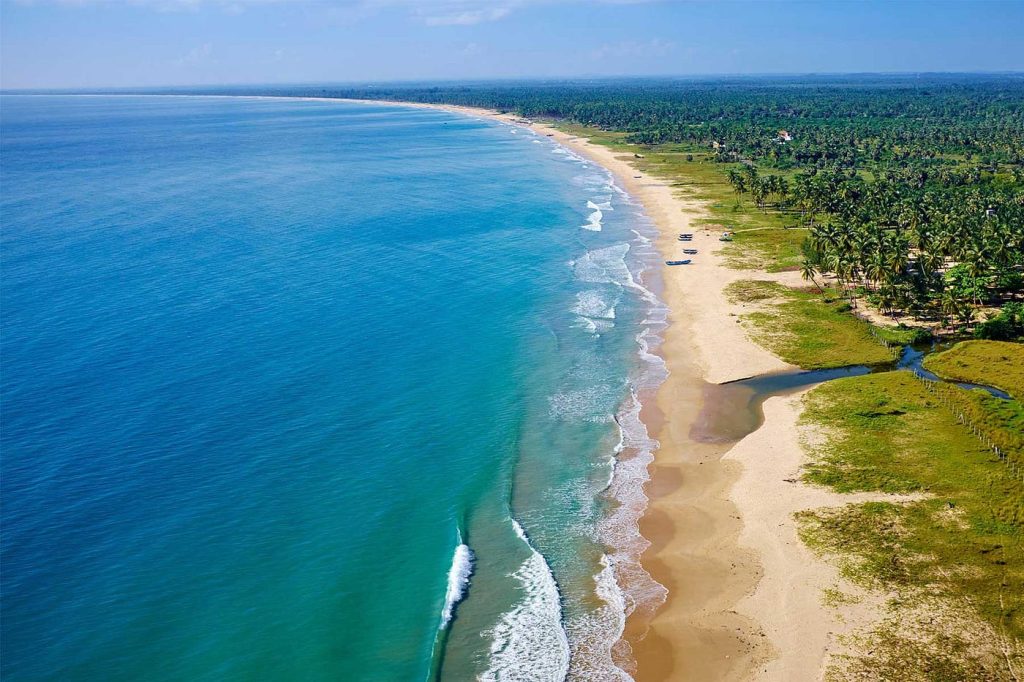 The serene Arugam Bay, a popular surfing location in Sri Lanka's Top 5 Adventure Destinations.