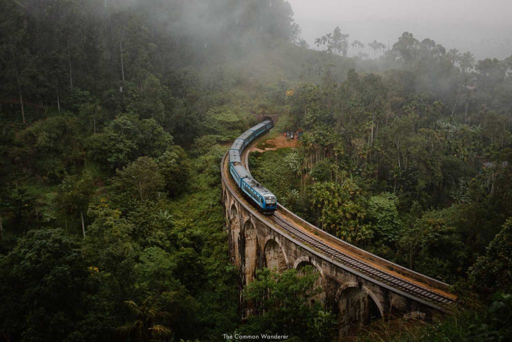 The iconic Nine Arch Bridge in Ella, part of the Top 5 Adventure Destinations in Sri Lanka, with a train passing through.
