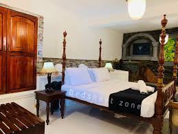 it reflects Sri Lankan luxuary beddings in a comfortable room. It is antique style decorated room